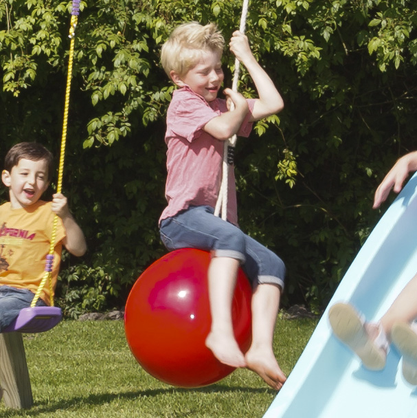 kid playing at a school playground equipment in canada